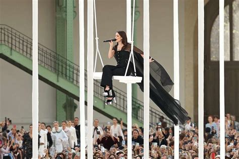 Riley Keough Performs in a Chanel Birdcage for Paris Fashion .